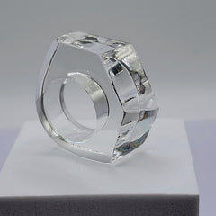 A ZENUS ring sitting on top of a Nik Spruill white box.