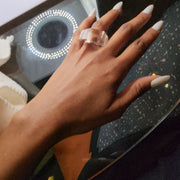 A woman's hand with a ZENUS ring by Nik Spruill on it.