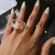 A woman's hand with a YIZ ring from Nik Spruill on it.