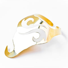 A NAWI gold and silver ring with a swirl design by Nik Spruill.