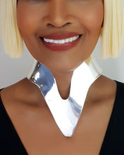A close up of a person wearing a Nik Spruill Nanisca Silver Necklace.