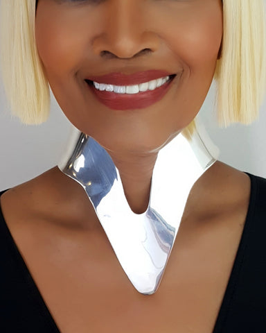 A close up of a person wearing a Nik Spruill Nanisca Silver Necklace.
