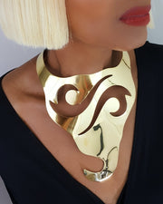A close up of a person wearing a Nik Spruill NAWI necklace.