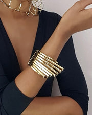 A woman wearing a HERU bracelet and a black top by Nik Spruill.