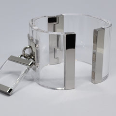 a DROP - SILVER cuff bracelet with a metal clasp by Nik Spruill.