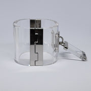 a DROP - SILVER clear plastic cuff with a metal clasp by Nik Spruill.