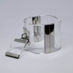 a DROP - SILVER cuff bracelet with a metal clasp by Nik Spruill.