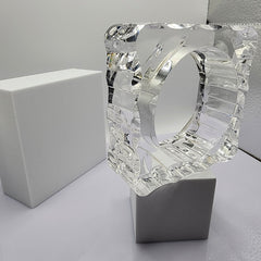A Nik Spruill METROPOLIS sculpture sitting on top of a white table.