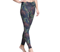 A woman in a black top and iYoga's CONSTELLATION LEGGING.
