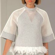 A model walks the runway in the Nik Spruill WAVES TOP at the fashion show.