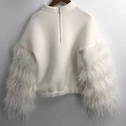 An AIR SPACE OFF WHITE TOP by Nik Spruill with white feathers on it.