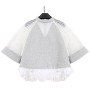 A grey and white Nik Spruill WAVES TOP with white fringes.
