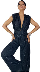 A woman in a Nik Spruill Glitz Sequined Jumpsuit - Black posing for a picture.