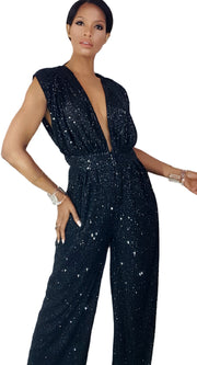 A woman in a Nik Spruill Glitz Sequined Jumpsuit - Black posing for a picture.