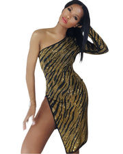 A woman posing in the Nik Spruill Escape One Shoulder Crystal Dress in gold and black.