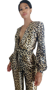 A woman wearing a Nik Spruill Savage sheen leopard print jumpsuit.