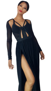 A woman in a Nik Spruill Session sheer strappy maxi dress - black with a slit.