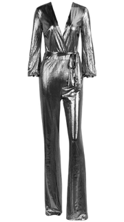 A Nik Spruill DASS silver metallic jumpsuit with a tie around the waist.