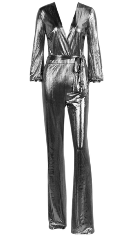 A Nik Spruill DASS silver metallic jumpsuit with a tie around the waist.