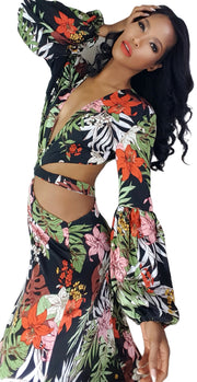 A woman in a Nik Spruill Shanti cutout flower maxi dress posing for a picture.