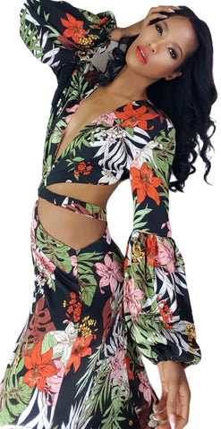 A woman in a Nik Spruill Shanti cutout flower maxi dress posing for a picture.