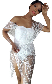 A woman in a Nik Spruill Truth Draped Crochet Midi Dress - White, posing for a picture.