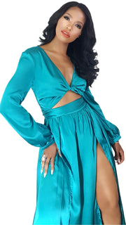 A woman in a Nik Spruill Limitless Double Slit Maxi Dress - Blue posing for a picture.