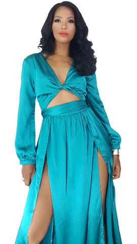 A woman in a Nik Spruill Limitless Double Slit Maxi Dress - Blue.