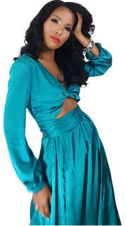 A woman in a Nik Spruill Limitless Double Slit Maxi Dress - Blue posing for a picture.