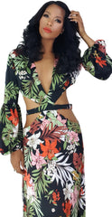 A woman in a Nik Spruill Shanti cutout flower maxi dress posing for a picture.