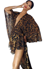A woman in a Monte Leopard Print Cape Romper by Nik Spruill posing for a photo.