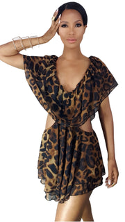 A woman in a Nik Spruill Sahaja leopard Cutout Romper posing for a picture.