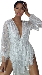 A woman in a Nik Spruill Dream Life Sequin Fringe Dress- White posing for a picture.