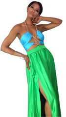 A woman in a Nik Spruill Love Color Block Chain Link Dress in green and blue.