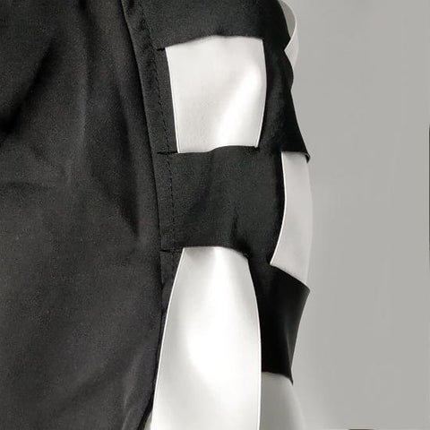a Nik Spruill CHECKMATE FRINGE JACKET with a white bow.