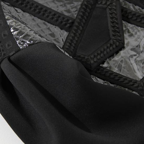 a close up of a Nik Spruill COMPLETION JACKET on a piece of cloth.