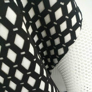 A close up of a Nik Spruill CONNECTION DRESS in black and white material.