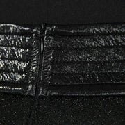 A close up of a Nik Spruill Freedom exotic leather midi skirt with a zipper.
