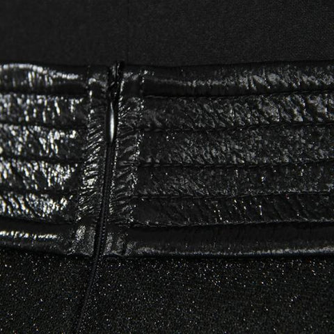 A close up of a Nik Spruill Freedom exotic leather midi skirt with a zipper.