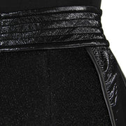 A close-up of a woman's Nik Spruill Freedom exotic leather midi skirt.