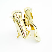 A close up of an OSHUN ring by Nik Spruill on a white background.