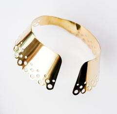 A close up of a Nik Spruill DAHOMEY bracelet on a white surface.