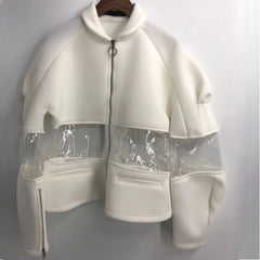 An Ocean 7 jacket by Nik Spruill hanging on a wall.