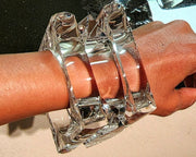 A person's arm with a Nik Spruill GLAZE bracelet on it.