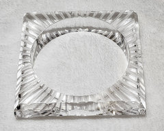 A square shaped FROSTY glass object on a white surface, by Nik Spruill.