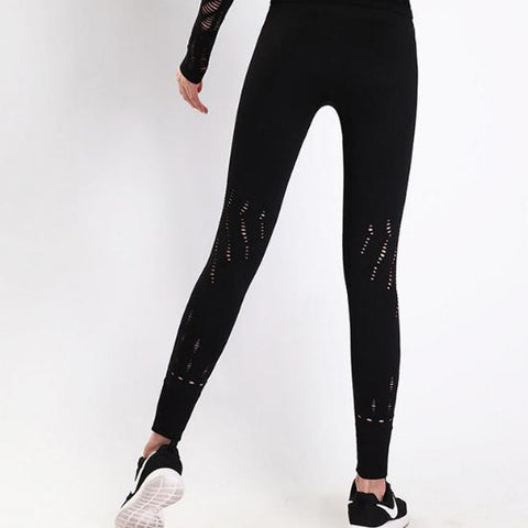 the back view of a woman wearing Nik Spruill's REBEL HIGH WAIST LEGGING BLACK.