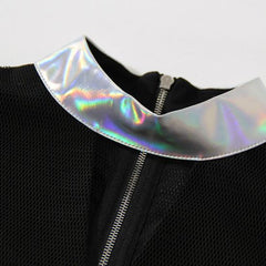 A close up of a Nik Spruill RELEASE TOP with a holographic collar.
