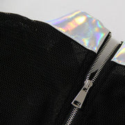 A Nik Spruill RELEASE TOP with a holographic zipper.