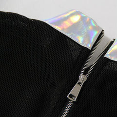 A Nik Spruill RELEASE TOP with a holographic zipper.