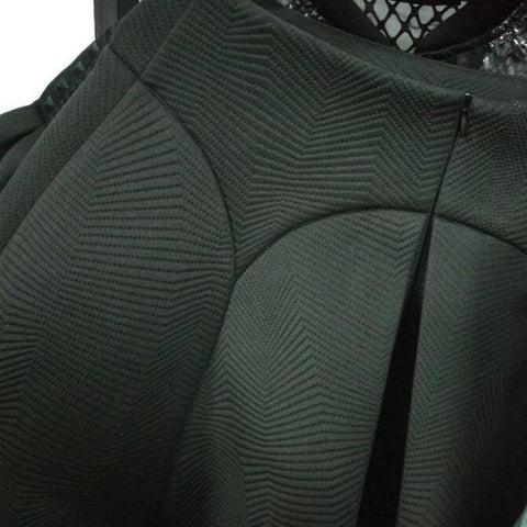 A close up of a Nik Spruill Spectator Skirt with a lace collar.